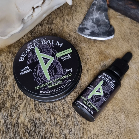 Beard balm and oil set on a fur surface with skull and stone in background