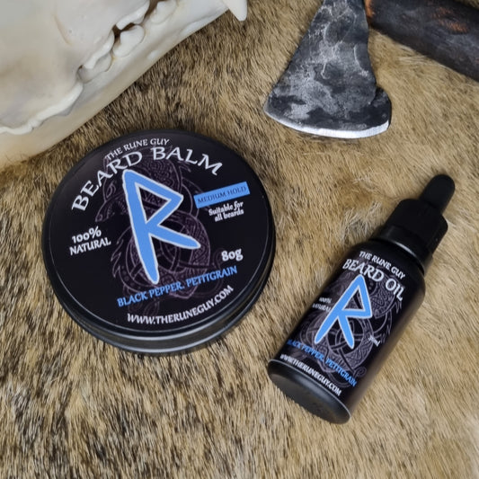 Beard balm and oil on a fur surface with a decorative axe.