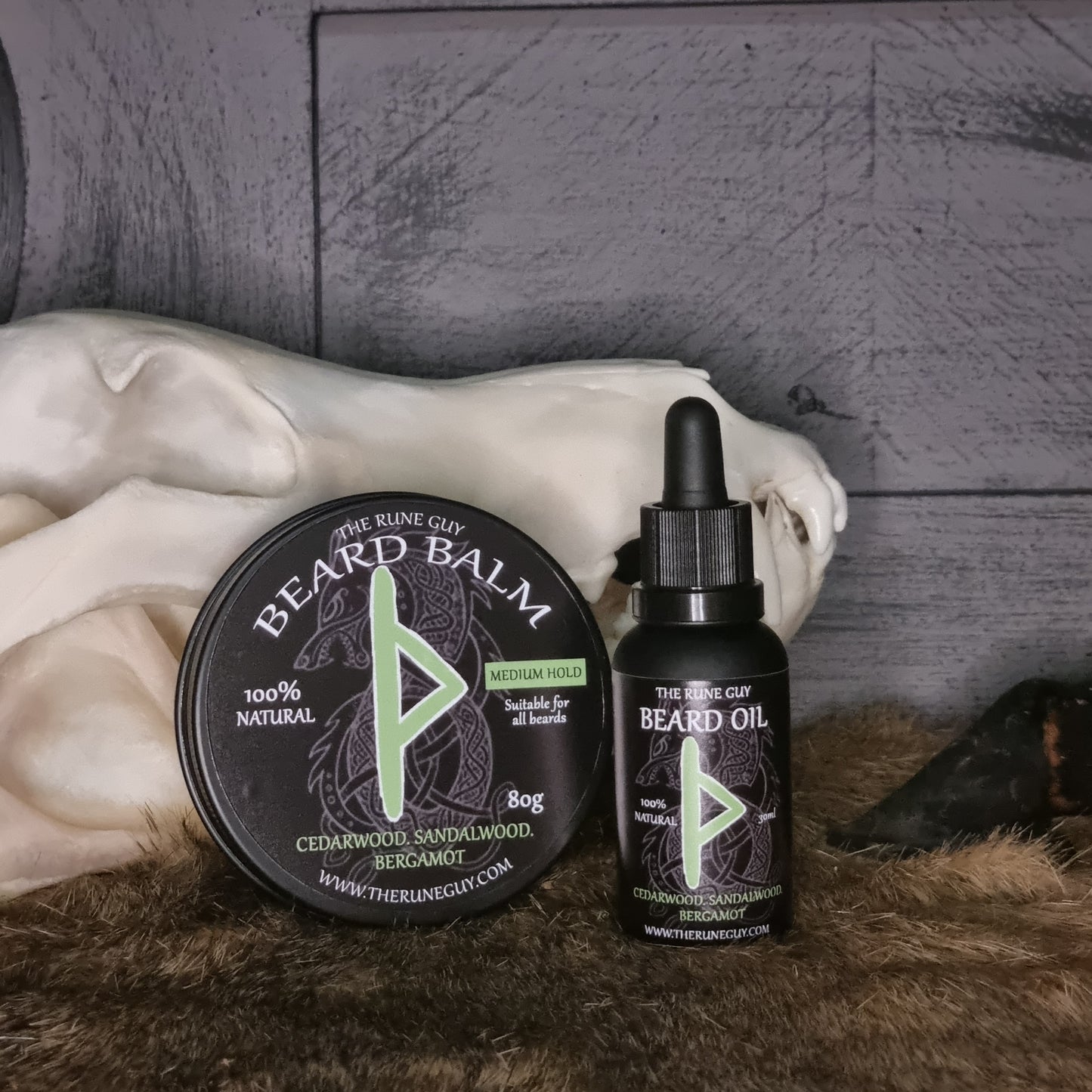 Beard care products including oil and balm on a textured surface.